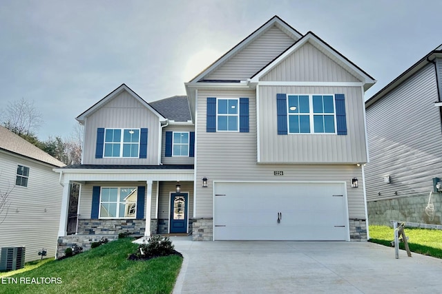 craftsman inspired home with stone siding, an attached garage, central AC unit, and board and batten siding