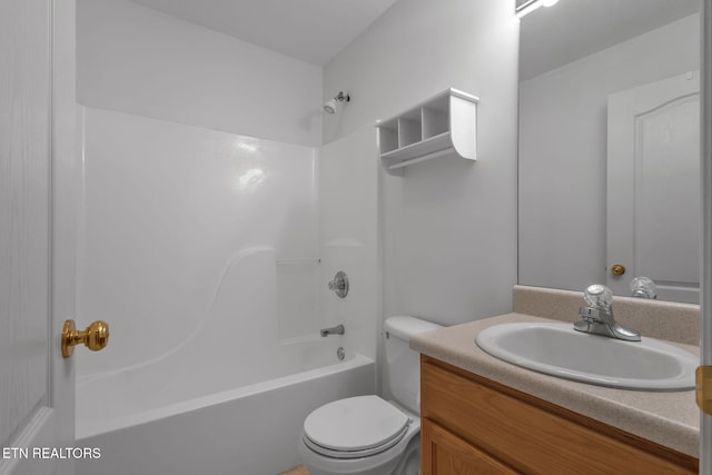 full bathroom with washtub / shower combination, toilet, and vanity
