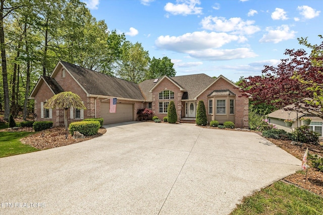 106 Mariners Dr, Fairfield Glade, TN 38558 - ranch-style home with concrete driveway, brick siding, a shingled roof, and a garage