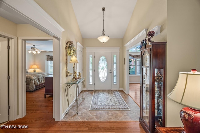 106 Mariners Dr, Fairfield Glade, TN 38558 - foyer featuring high vaulted ceiling, a ceiling fan, and wood finished floors