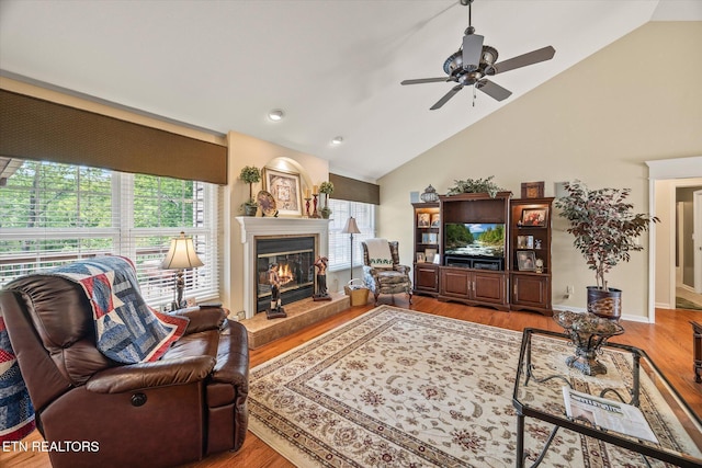 106 Mariners Dr, Fairfield Glade, TN 38558 - living room with a glass covered fireplace, a wealth of natural light, ceiling fan, and lofted ceiling