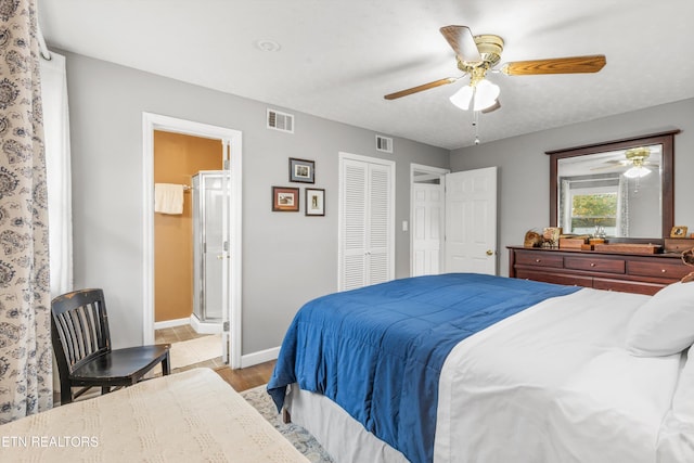 bedroom featuring baseboards, light wood-style flooring, connected bathroom, visible vents, and ceiling fan