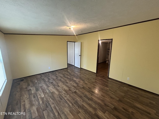 230 Hitch St, Vonore, TN 37885 - spare room featuring ornamental molding, dark wood-type flooring, and a textured ceiling