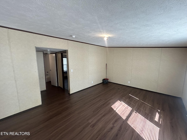 230 Hitch St, Vonore, TN 37885 - spare room with dark wood finished floors, crown molding, and a textured ceiling