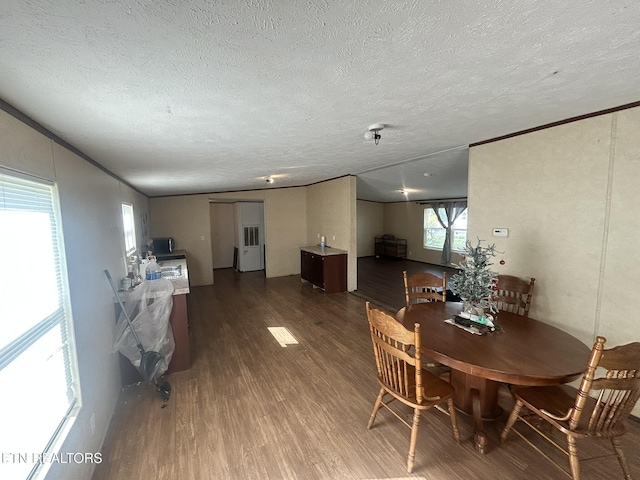 230 Hitch St, Vonore, TN 37885 - dining room with a textured ceiling, wood finished floors, and ornamental molding