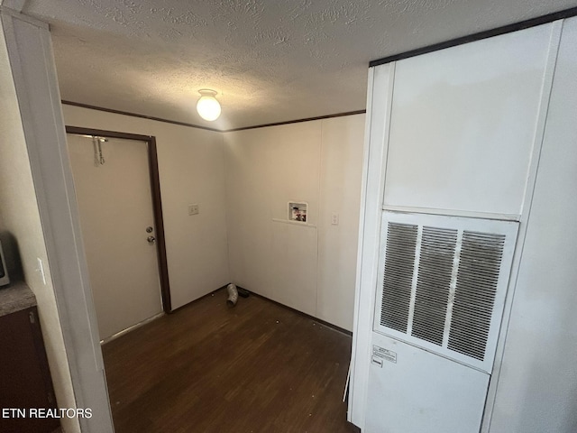 230 Hitch St, Vonore, TN 37885 - empty room featuring wood finished floors, a heating unit, and a textured ceiling