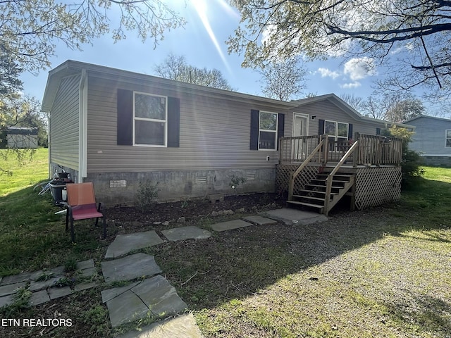 230 Hitch St, Vonore, TN 37885 - manufactured / mobile home featuring stairs, a front lawn, a wooden deck, and crawl space