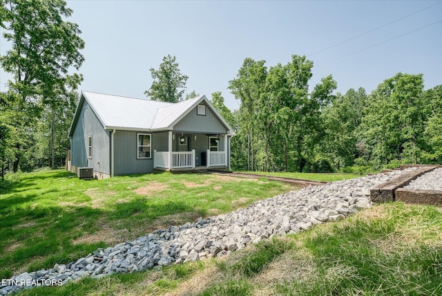 299 Shire Ln, Celina, TN 38551 - ranch-style home with a porch, a front lawn, metal roof, cooling unit, and driveway