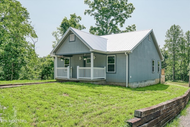 299 Shire Ln, Celina, TN 38551 - view of front facade featuring covered porch, a front yard, and metal roof