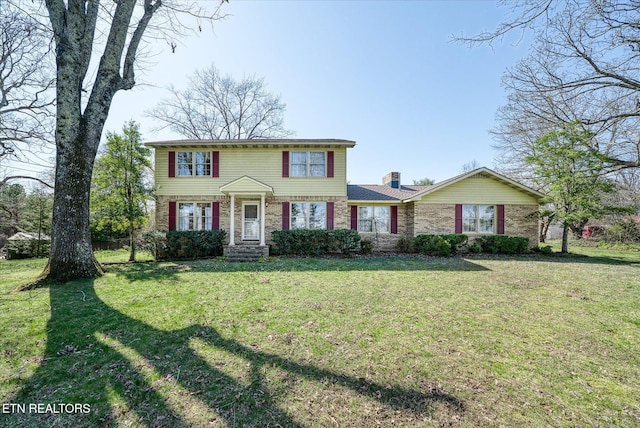 1441 Bunker Hill Rd, Cookeville, TN 38506 - view of front of house with brick siding, a front yard, and a chimney