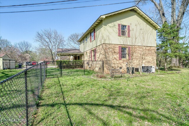 1441 Bunker Hill Rd, Cookeville, TN 38506 - view of home's exterior with brick siding, fence, crawl space, and a yard