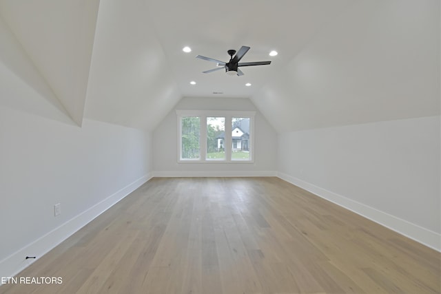 bonus room with baseboards, light wood-style flooring, ceiling fan, recessed lighting, and vaulted ceiling