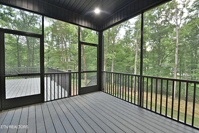 unfurnished sunroom featuring plenty of natural light