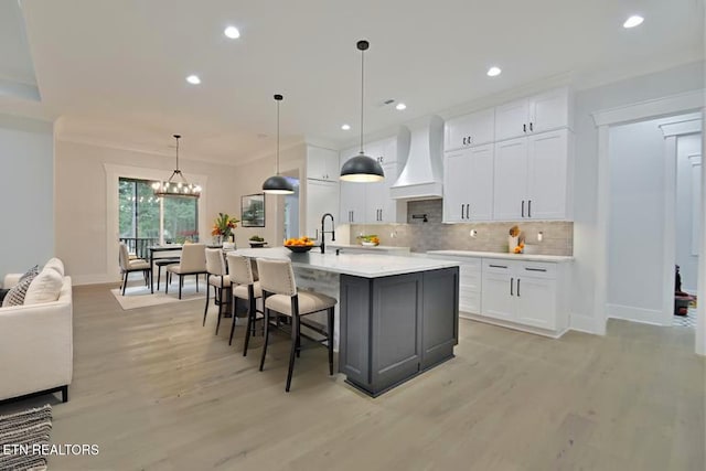 336 Nuhya Ln, Loudon, TN 37774 - kitchen with premium range hood, light wood-type flooring, tasteful backsplash, white cabinetry, and recessed lighting