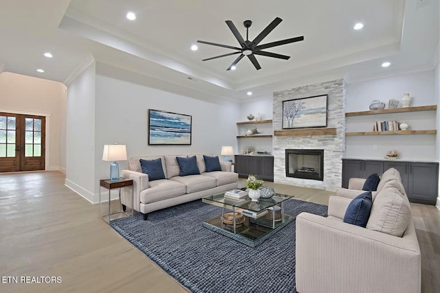 336 Nuhya Ln, Loudon, TN 37774 - living area featuring a tray ceiling, a ceiling fan, light wood-style flooring, baseboards, and recessed lighting