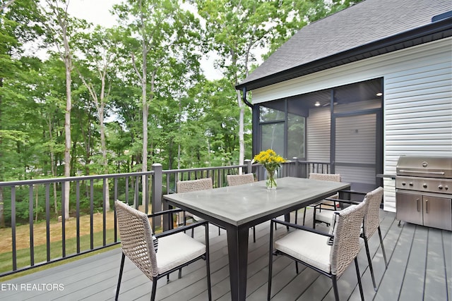 336 Nuhya Ln, Loudon, TN 37774 - wooden deck with outdoor dining area and a sunroom