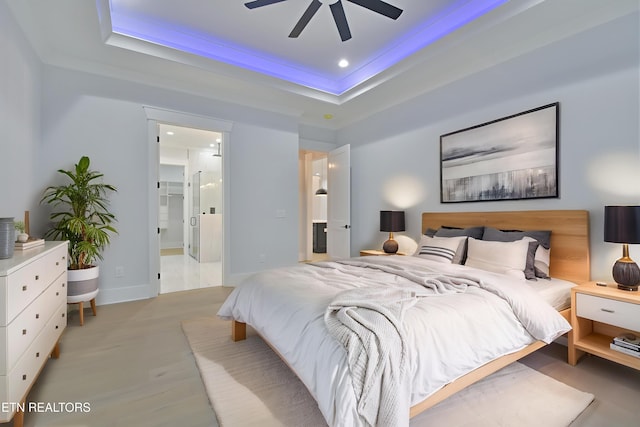 336 Nuhya Ln, Loudon, TN 37774 - bedroom with a tray ceiling, light wood-type flooring, connected bathroom, ceiling fan, and recessed lighting
