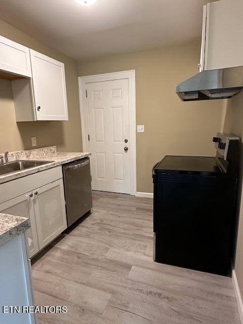 kitchen featuring black electric range, stainless steel dishwasher, light wood-type flooring, a sink, and white cabinetry