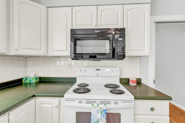 kitchen featuring white cabinets, electric range, dark countertops, decorative backsplash, and black microwave