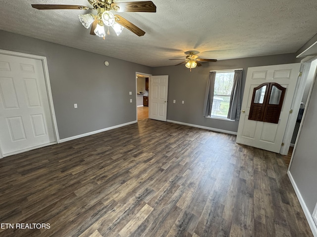 foyer entrance with baseboards, dark wood-style floors, and ceiling fan