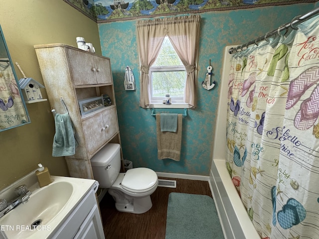 full bathroom featuring baseboards, wallpapered walls, toilet, and wood finished floors