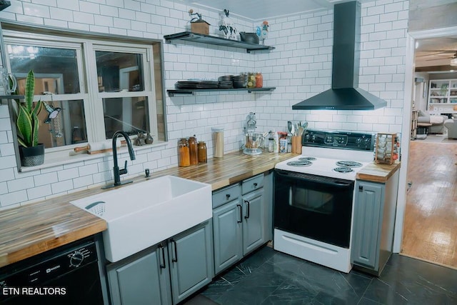kitchen featuring black dishwasher, backsplash, electric stove, wall chimney exhaust hood, and butcher block countertops