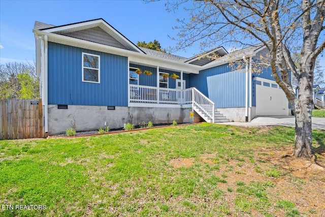 single story home featuring concrete driveway, fence, an attached garage, a front lawn, and covered porch