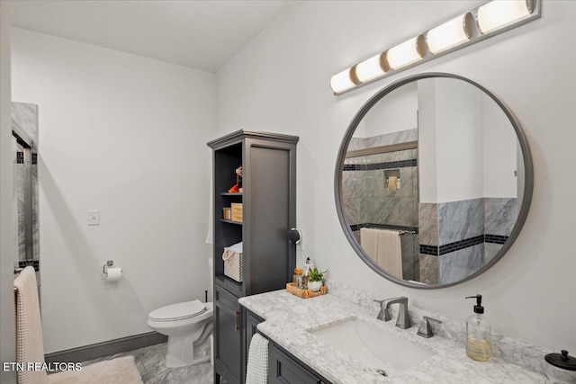 full bathroom featuring toilet, a shower, and vanity