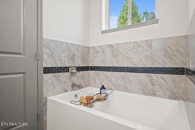 bathroom featuring a garden tub
