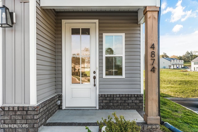 doorway to property with a porch