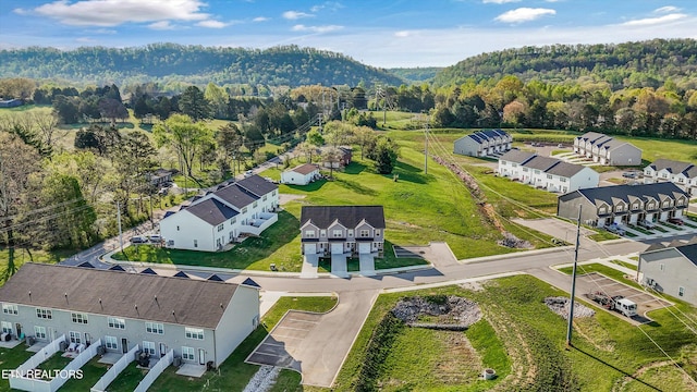 birds eye view of property with a forest view