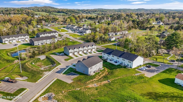birds eye view of property with a residential view