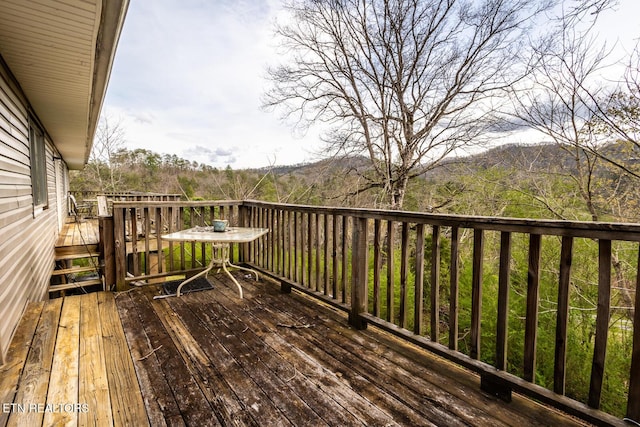 wooden deck featuring a mountain view