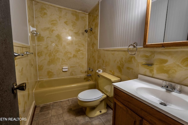 bathroom featuring vanity, washtub / shower combination, and toilet