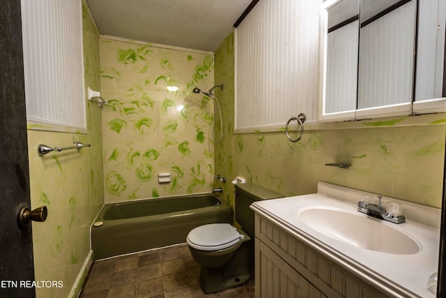 bathroom with vanity, a textured ceiling, toilet, and wallpapered walls