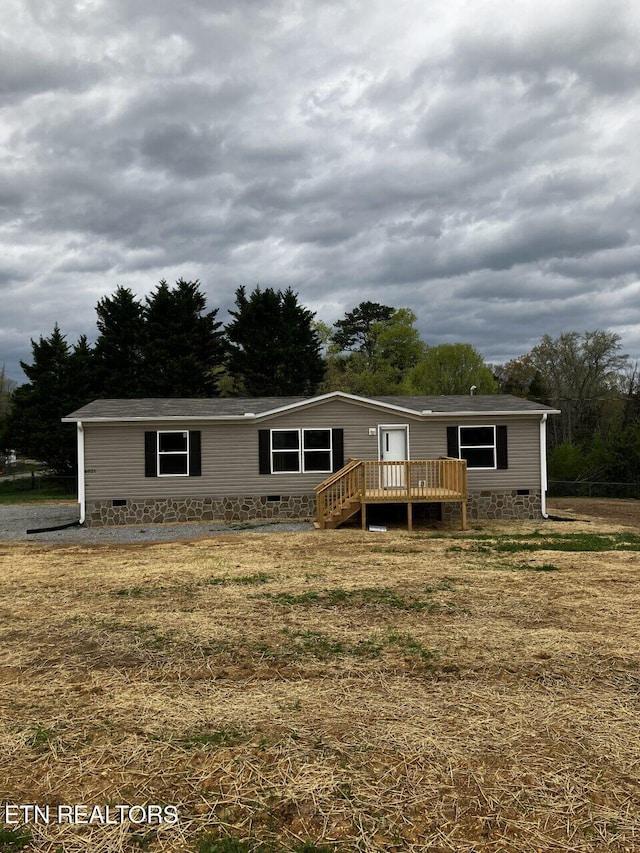 manufactured / mobile home featuring crawl space and a deck