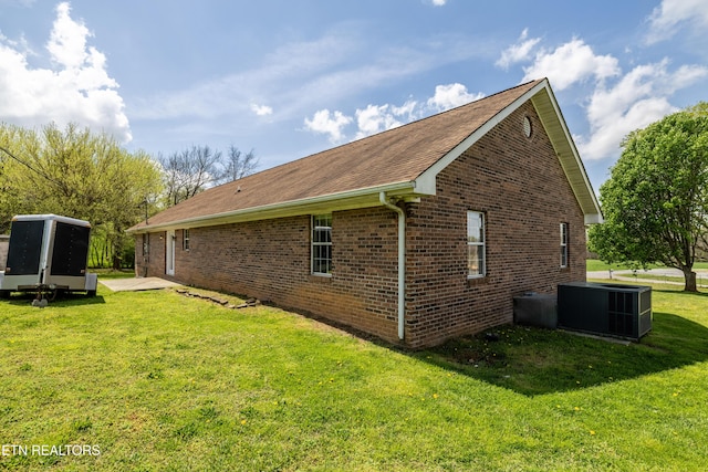 709 Head Of Creek Rd, Sweetwater, TN 37874 - view of home's exterior with central air condition unit, a yard, brick siding, and roof with shingles