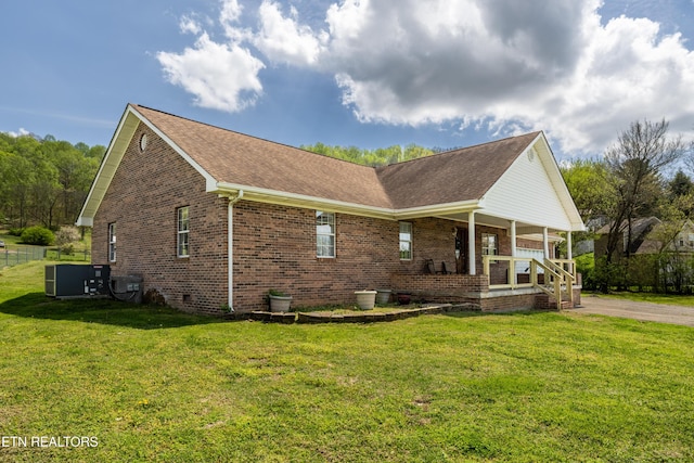 709 Head Of Creek Rd, Sweetwater, TN 37874 - view of home's exterior with a porch, a yard, brick siding, and roof with shingles