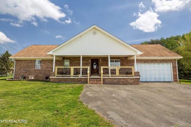 709 Head Of Creek Rd, Sweetwater, TN 37874 - view of front of home with covered porch, a front yard, brick siding, and driveway