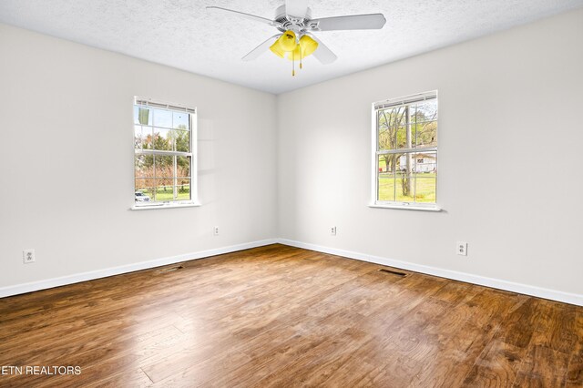 709 Head Of Creek Rd, Sweetwater, TN 37874 - unfurnished room with healthy amount of natural light, wood finished floors, baseboards, ceiling fan, and a textured ceiling