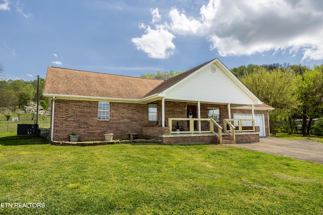 709 Head Of Creek Rd, Sweetwater, TN 37874 - view of front of property with a porch, driveway, a front lawn, brick siding, and roof with shingles