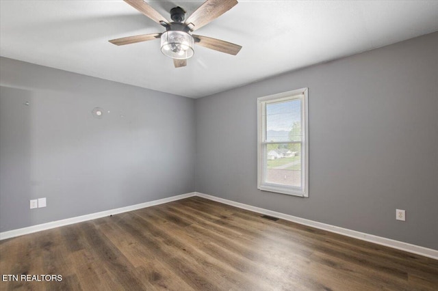 174 Sandy Hill Rd, Lafollette, TN 37766 - empty room featuring wood finished floors, visible vents, and baseboards