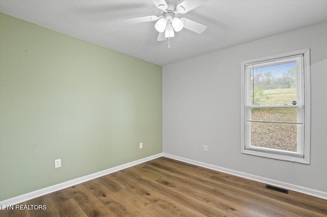 174 Sandy Hill Rd, Lafollette, TN 37766 - spare room with baseboards, visible vents, wood finished floors, and ceiling fan