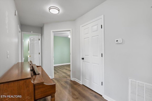 174 Sandy Hill Rd, Lafollette, TN 37766 - hall with dark wood-style floors, visible vents, and baseboards
