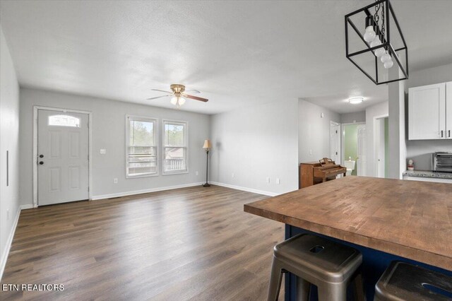 174 Sandy Hill Rd, Lafollette, TN 37766 - dining room with a toaster, dark wood-style floors, ceiling fan, and baseboards