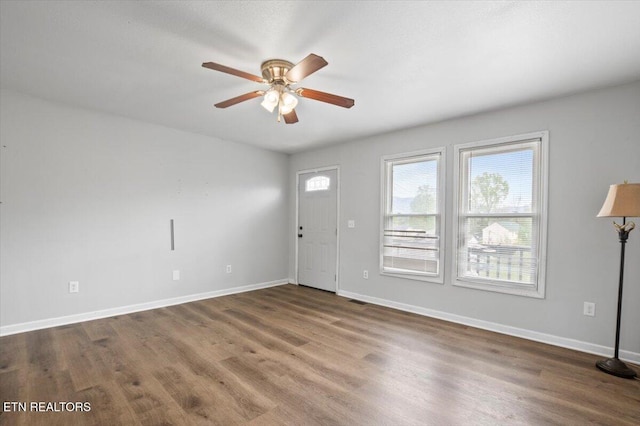 174 Sandy Hill Rd, Lafollette, TN 37766 - entrance foyer featuring wood finished floors, ceiling fan, and baseboards