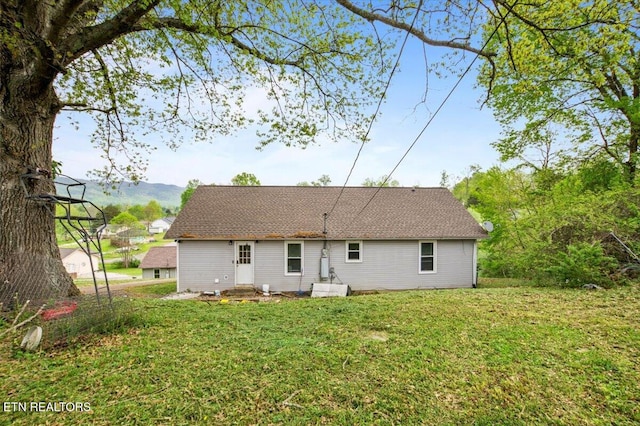 174 Sandy Hill Rd, Lafollette, TN 37766 - back of property featuring roof with shingles, a yard, and a mountain view