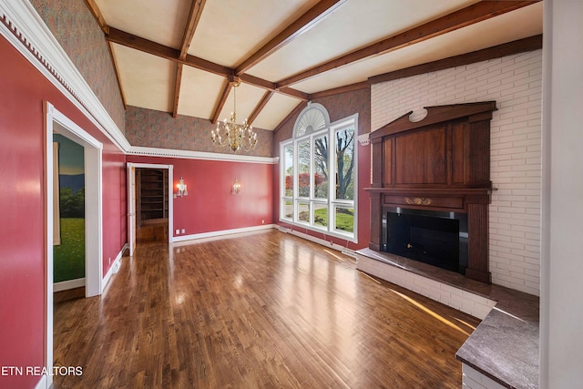212 Douglas Ave, Sweetwater, TN 37874 - unfurnished living room with baseboards, lofted ceiling with beams, a chandelier, a fireplace, and wood finished floors
