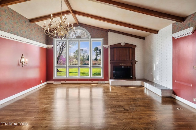 212 Douglas Ave, Sweetwater, TN 37874 - unfurnished living room with baseboards, a chandelier, a fireplace, wood finished floors, and vaulted ceiling with beams