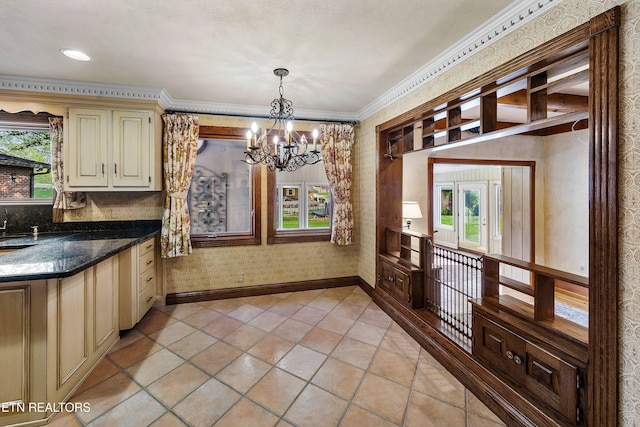 212 Douglas Ave, Sweetwater, TN 37874 - unfurnished dining area with a notable chandelier, baseboards, wallpapered walls, and ornamental molding